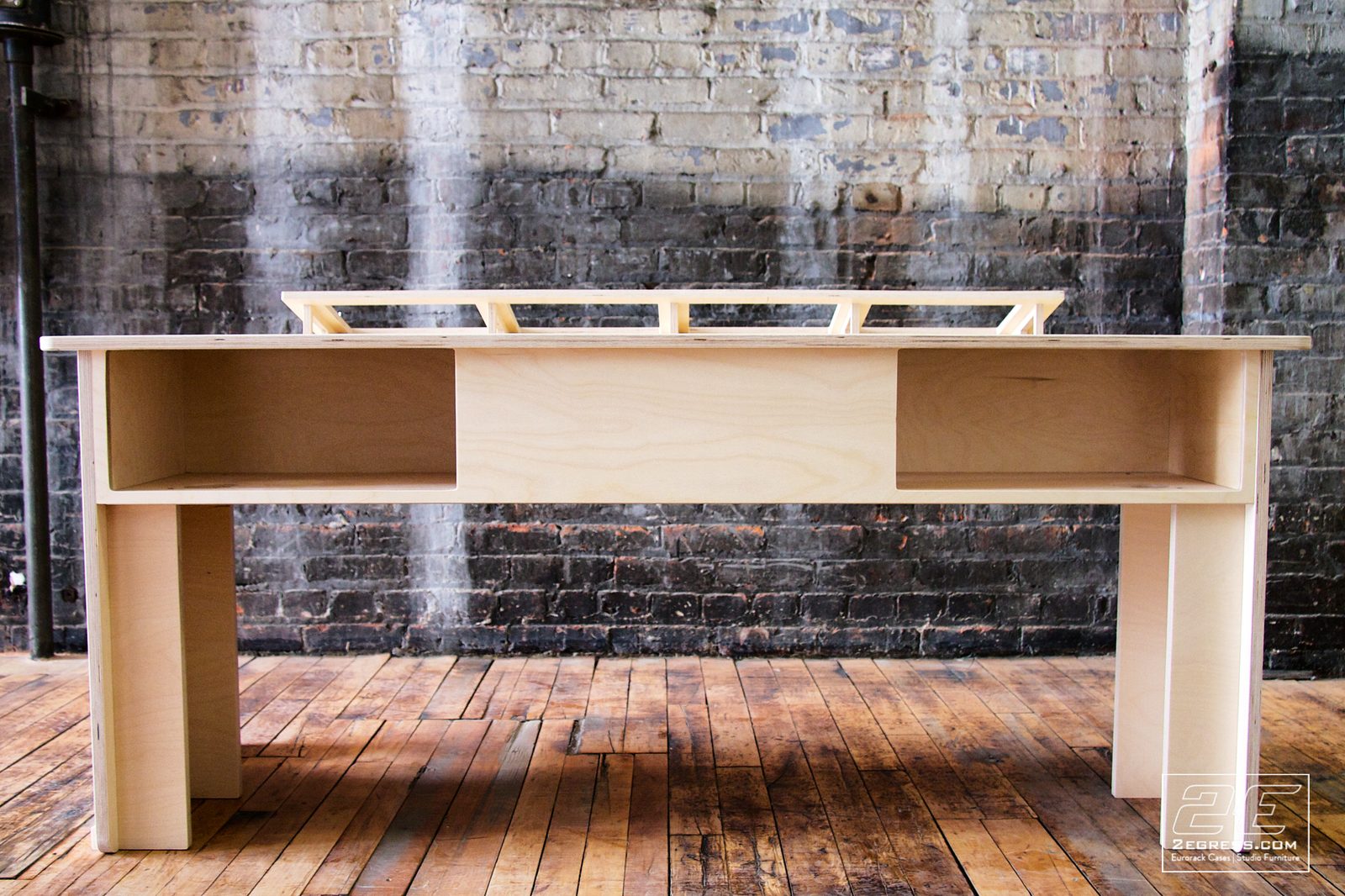 Controlfreak for Avid Artist desk | front view with under-desk cubbies flanking the center support panel | 2Egress