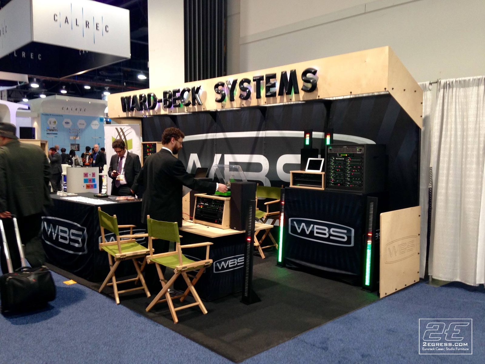 Dauntless Slant Rack Series | mounted at a Ward-Beck Systems trade show booth | 2Egress