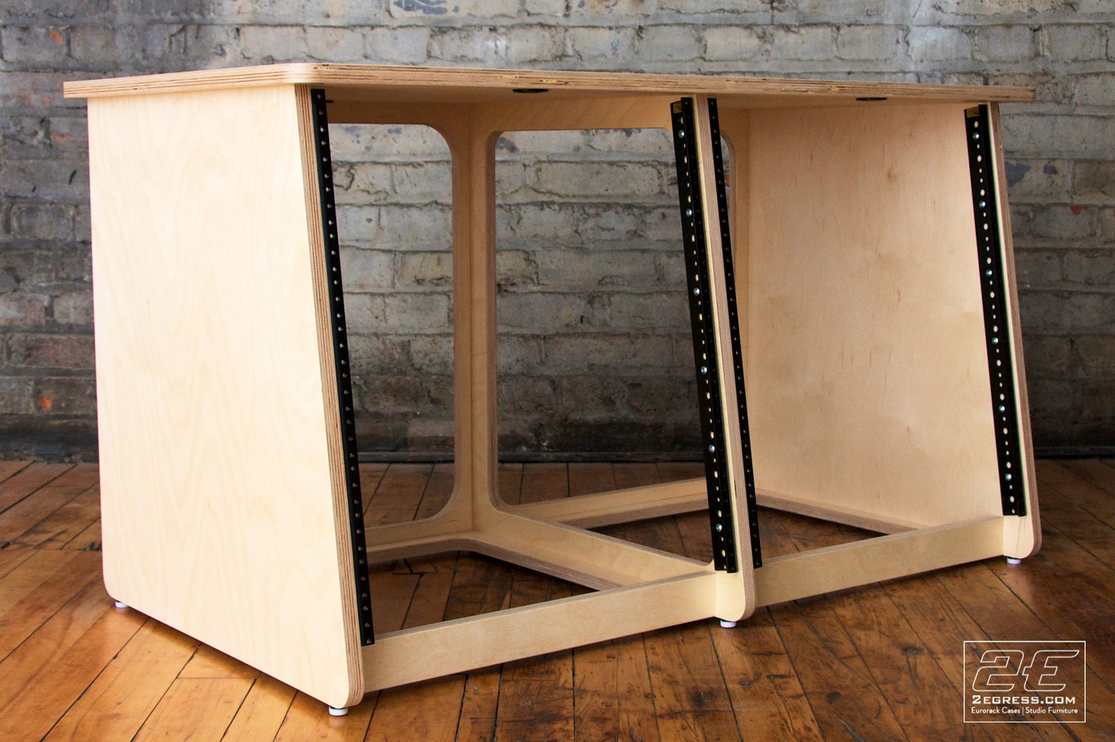 Double Bay Rack | 12U, natural birch finish, angled three-quarter view showing rack rails in both bays | 2Egress