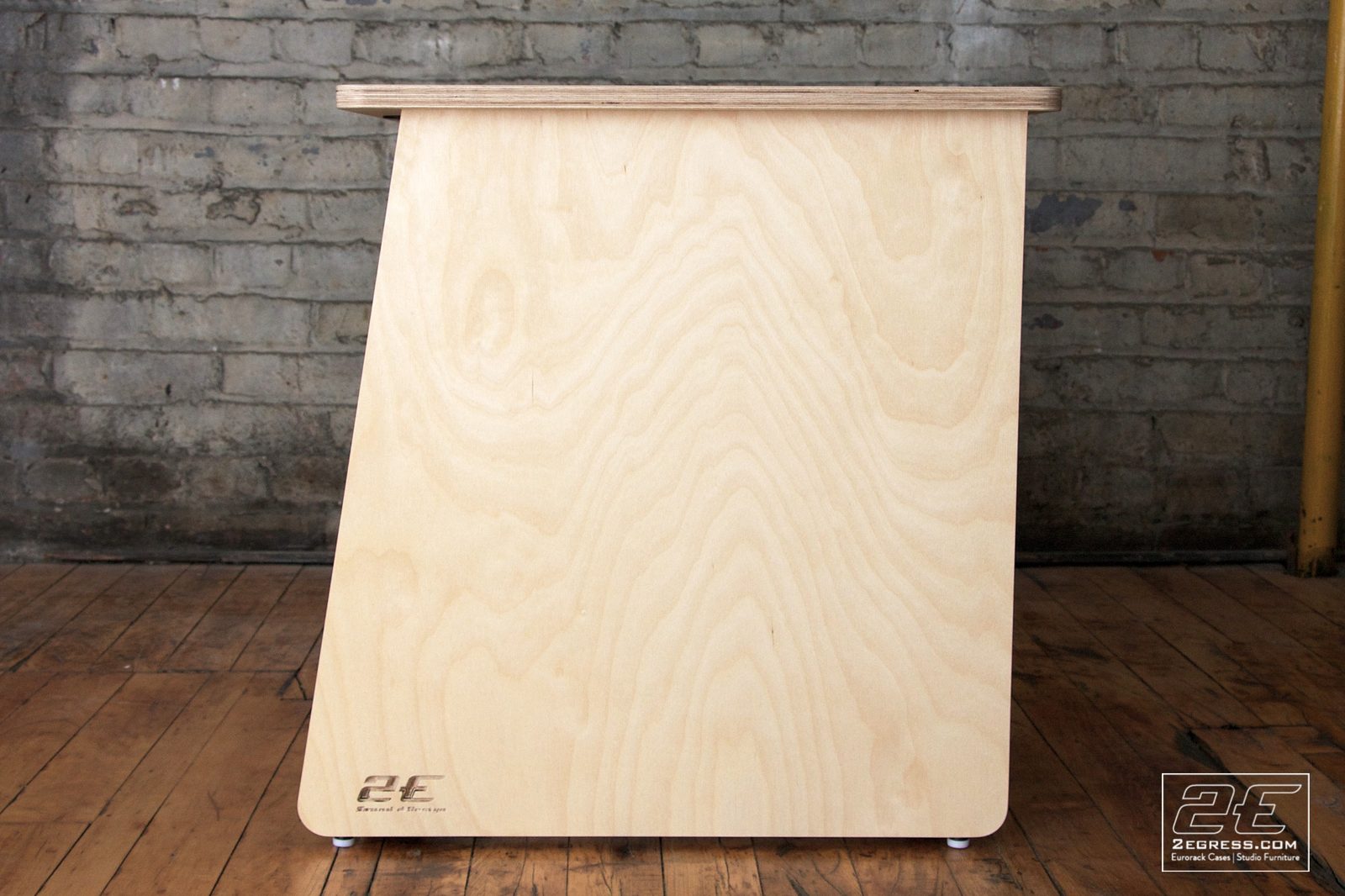 Double Bay Rack | 12U, natural birch finish, angled view showing the circular cable-pass cutouts in the center divider | 2Egress