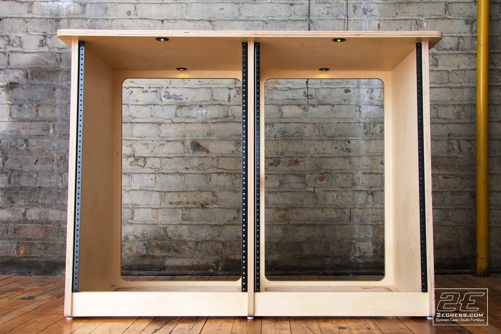 Double Bay Rack | 16U, natural birch finish, front view with motion-sensing LED downlights over both bays | 2Egress