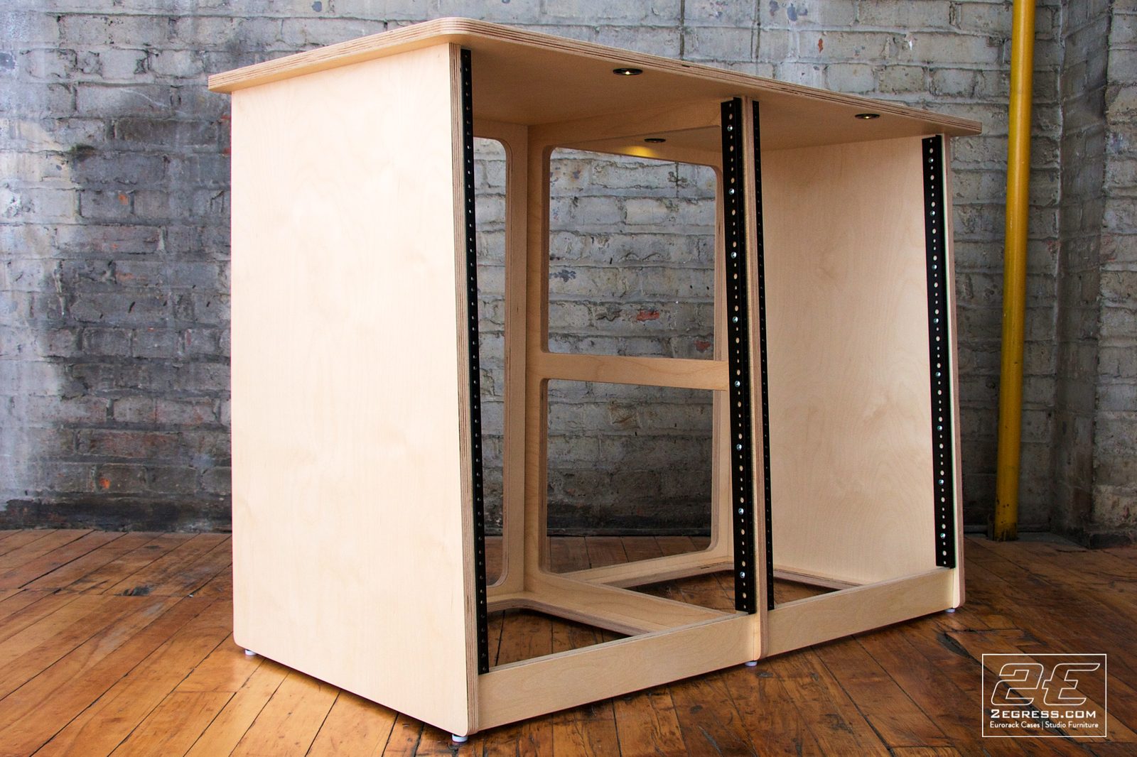 Double Bay Rack | 16U, natural birch finish, angled three-quarter view showing the internal support beam | 2Egress