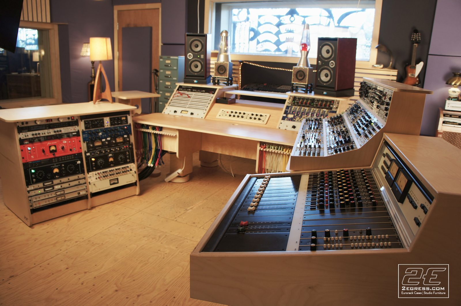 Double Bay Rack | in Damian Taylor's studio, control room view with the mixing console, monitors, and lava lamp | 2Egress