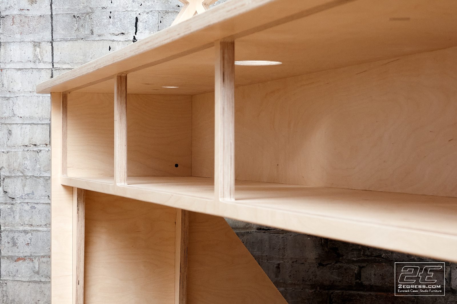 Facet desk | close detail of the underside shelf compartments and cable cutouts | 2Egress