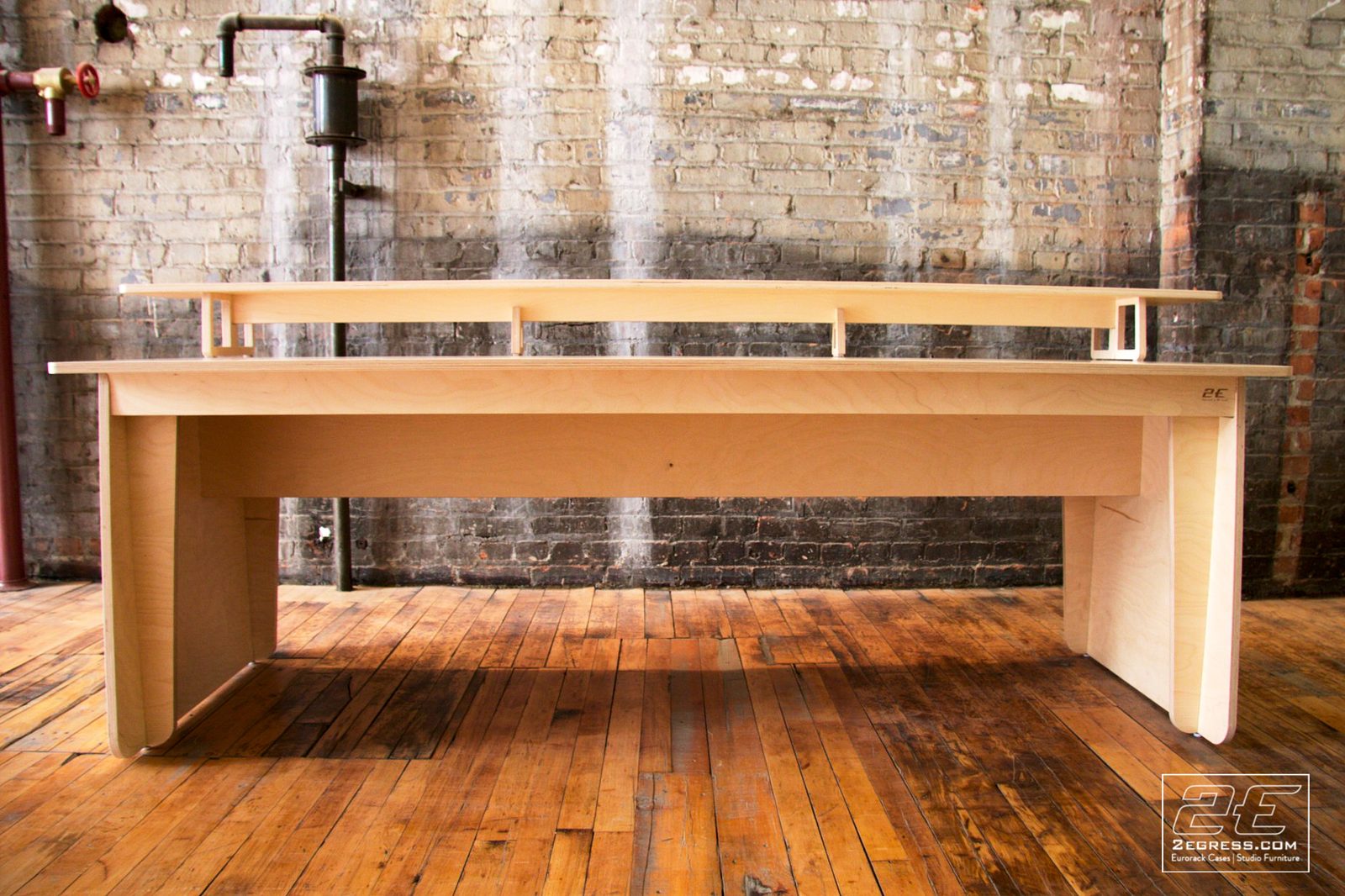 Film Rev 2 desk | front view showing the full-length raised shelf on standoff brackets | 2Egress