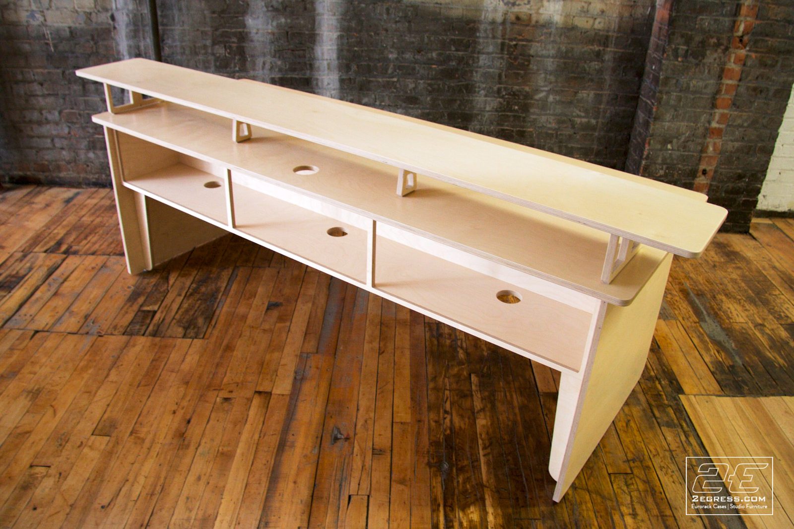Film Rev 2 desk | angled view of the storage cubbies with cable grommet holes | 2Egress