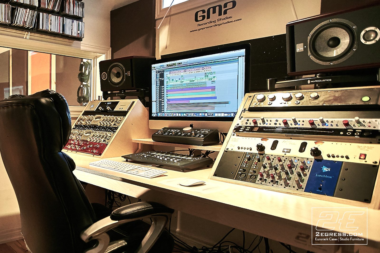 Marito Marques | Angled view of the Pintassilgo desk and chair with outboard gear racks at GMP Recording Studios | Studio Egregia