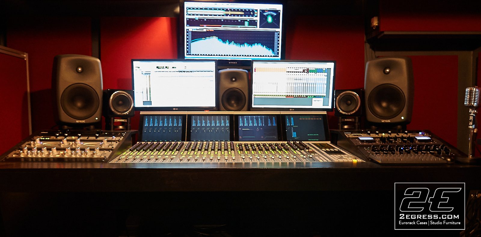 Stealth for Avid System 5 desk | installed in a red-lit studio with dual Genelec monitors flanking the Avid System 5 console | 2Egress