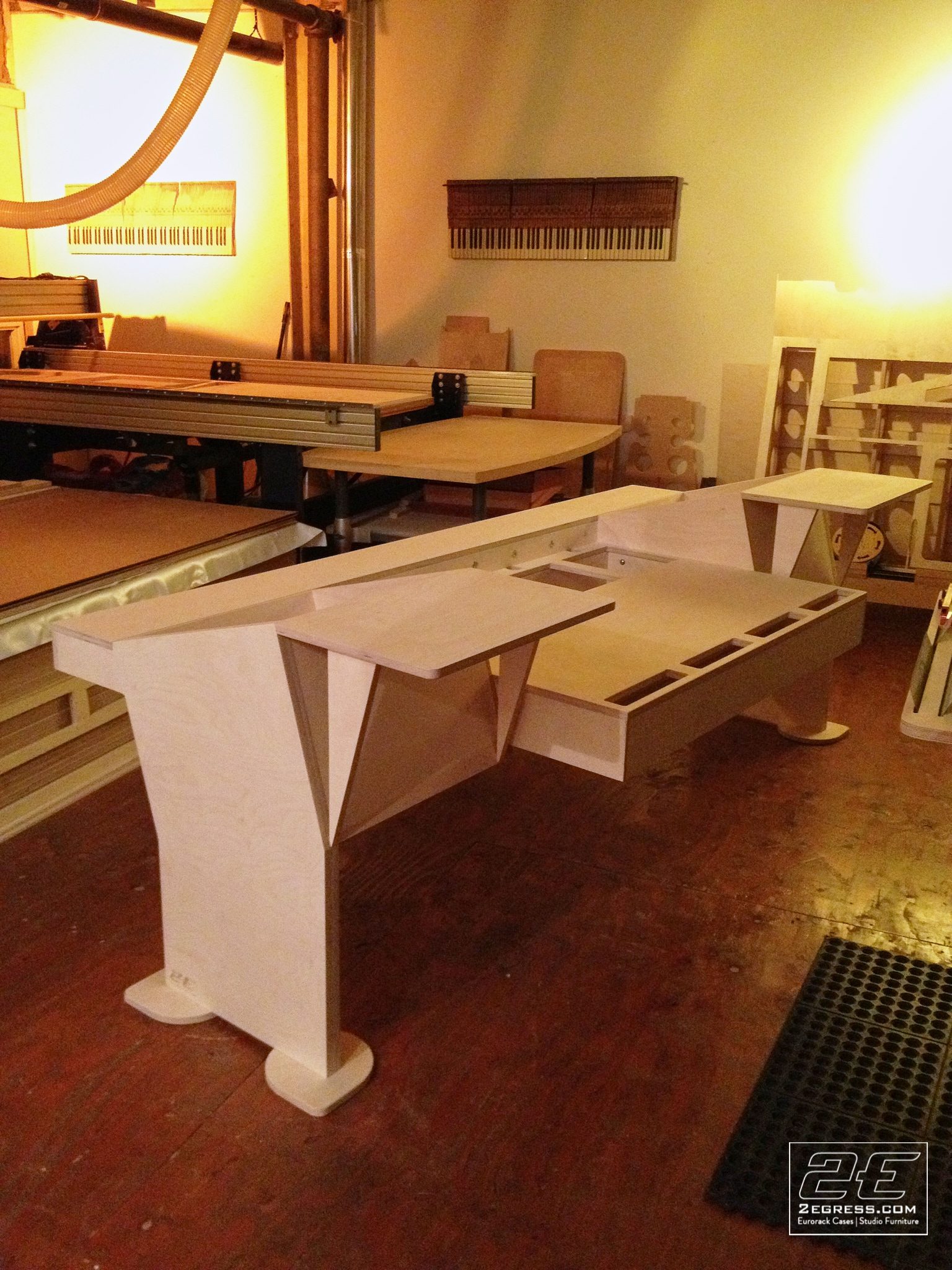 Stealth for Avid System 5 desk | raw plywood construction, wide angled view of the workshop | 2Egress