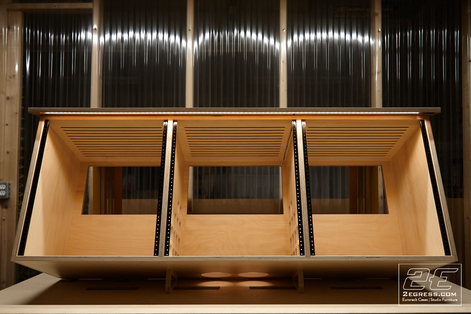 Stinger rack desk | front view with LED-lit rack bays | 2Egress