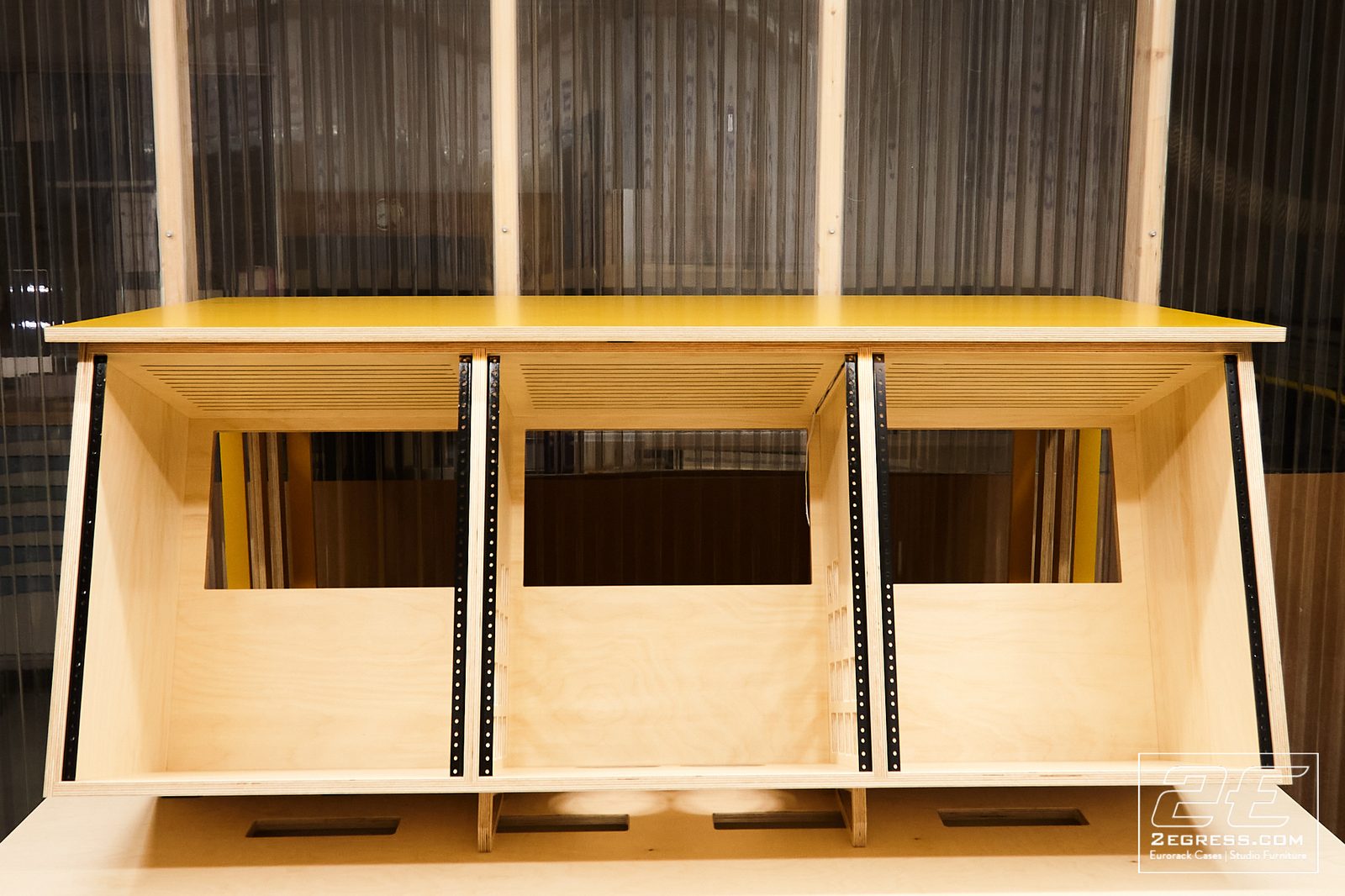 Stinger rack desk | front view, yellow top with rack bays | 2Egress