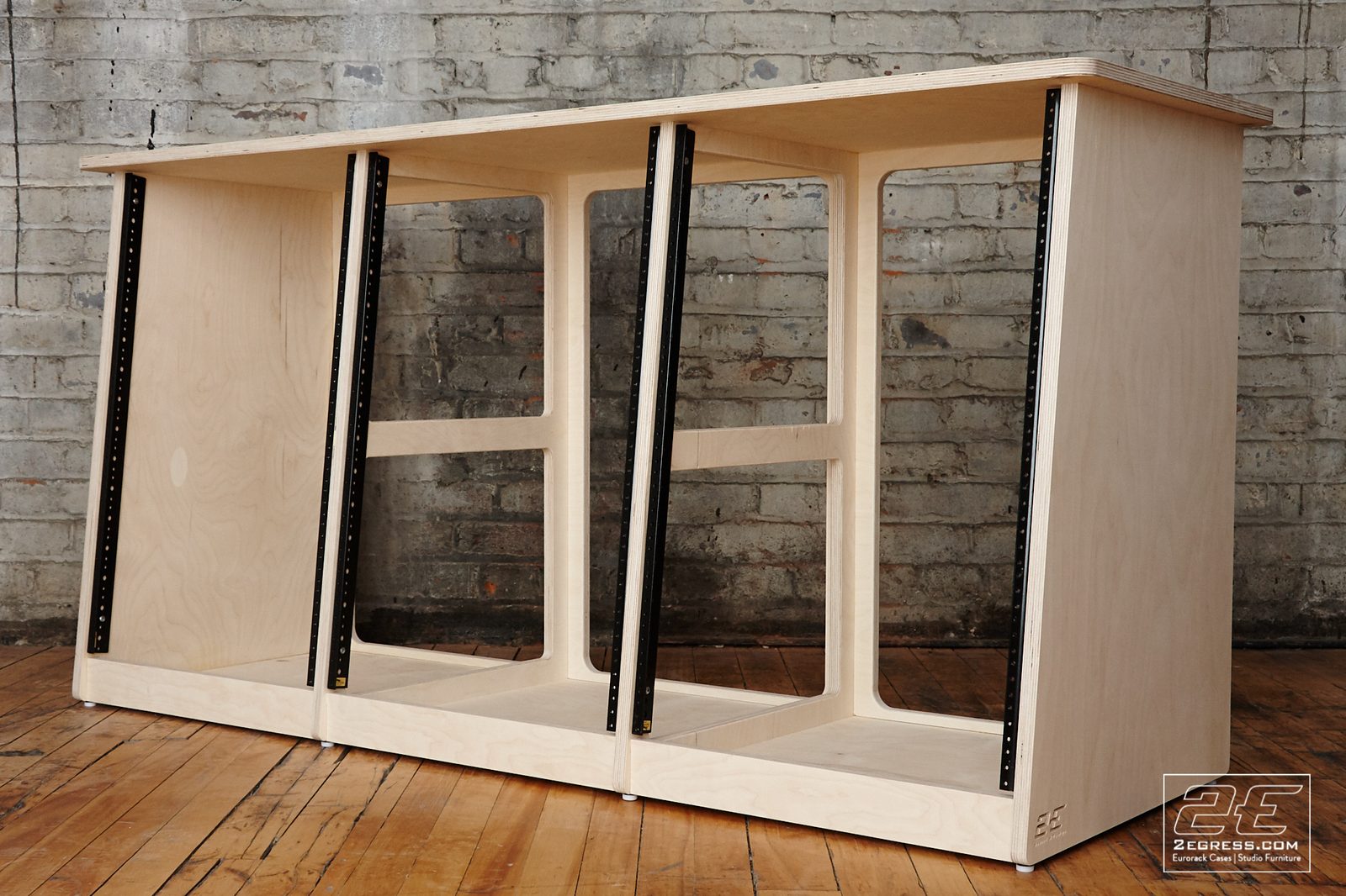 Triple Bay Rack | natural birch finish, angled three-quarter view of the three rack bays | 2Egress