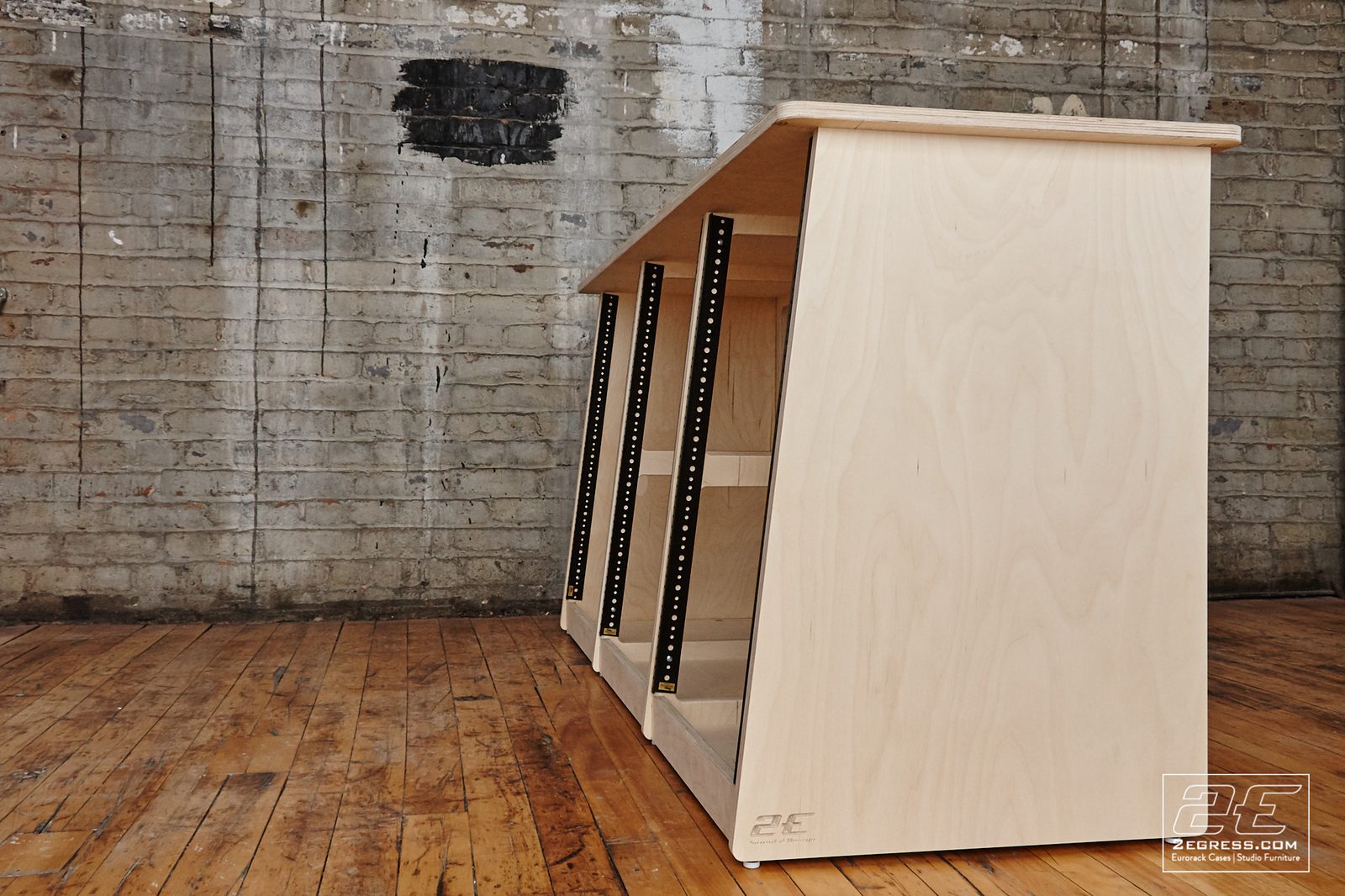 Triple Bay Rack | natural birch finish, angled side view showing the rack rails | 2Egress
