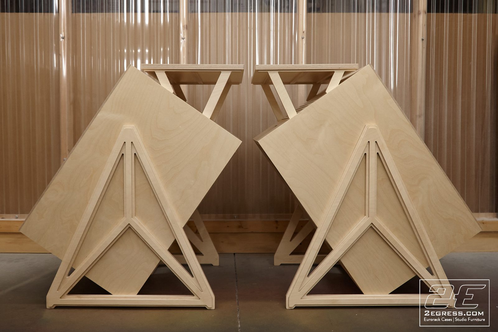 Voyager I studio rack | pair viewed from rear, mirrored triangular leg detail | 2Egress