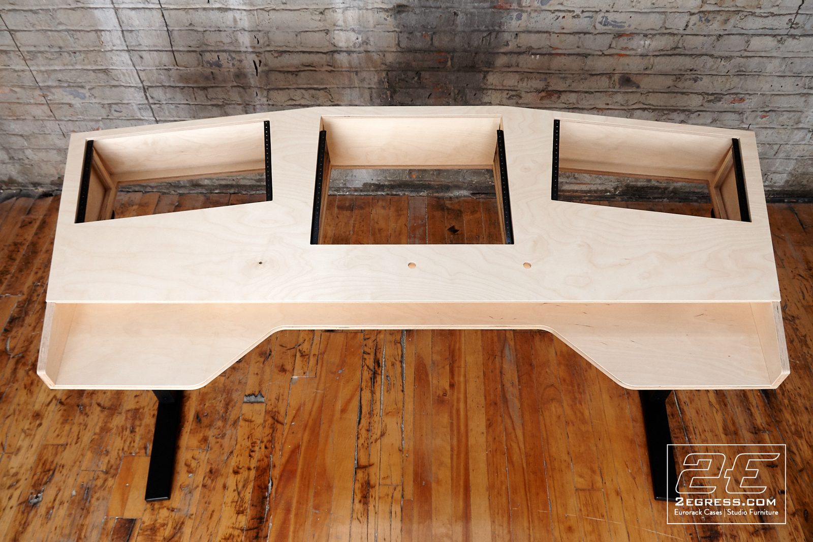 VTOL studio desk | overhead front view, raw construction | 2Egress