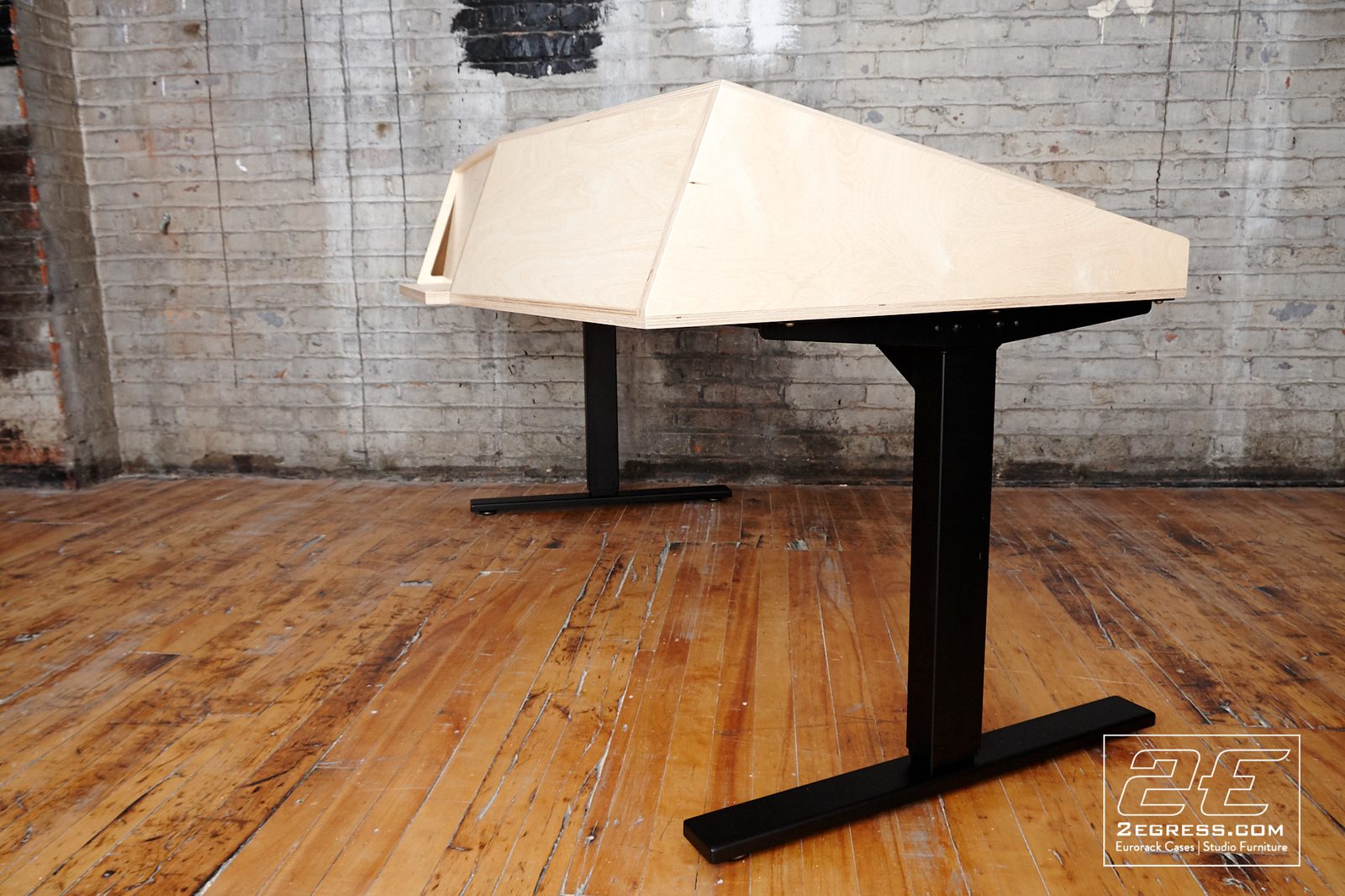 VTOL studio desk | rear three-quarter view, raw construction | 2Egress