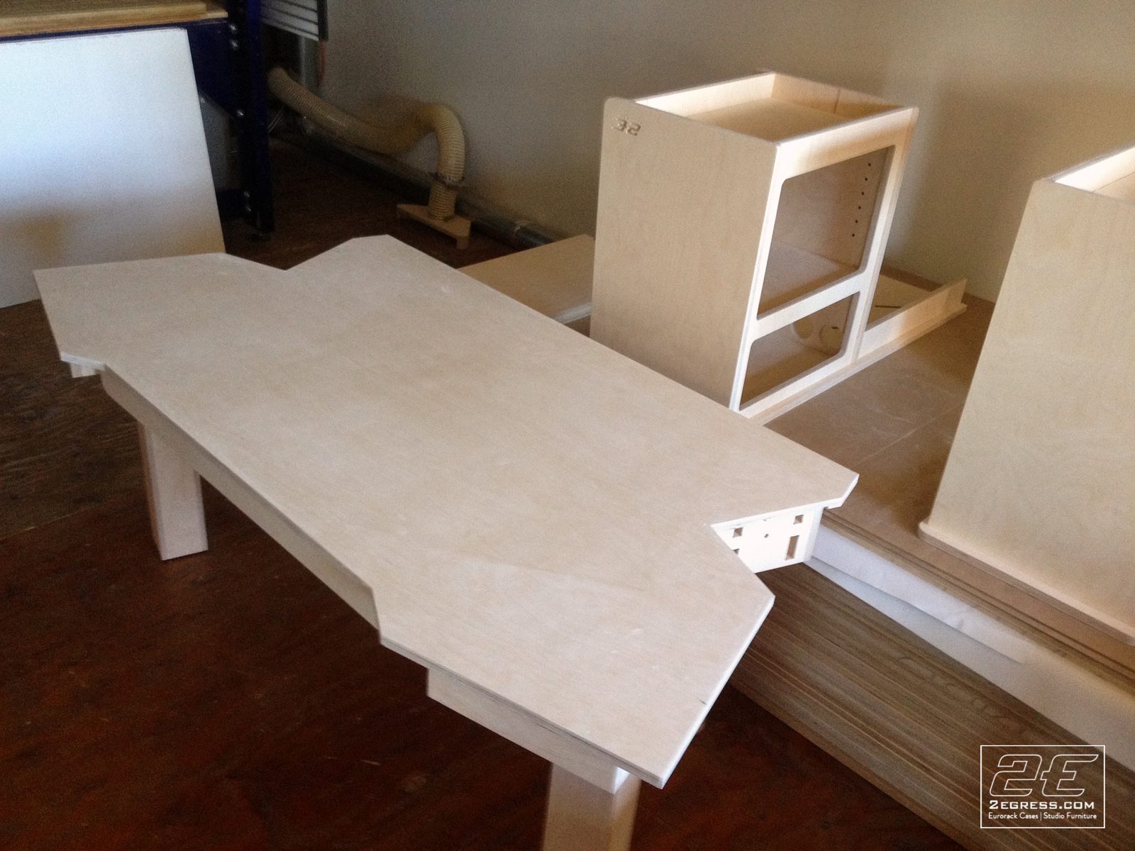 Wing Commander composer desk | angled view with left rack wing extended, workshop setting | 2Egress