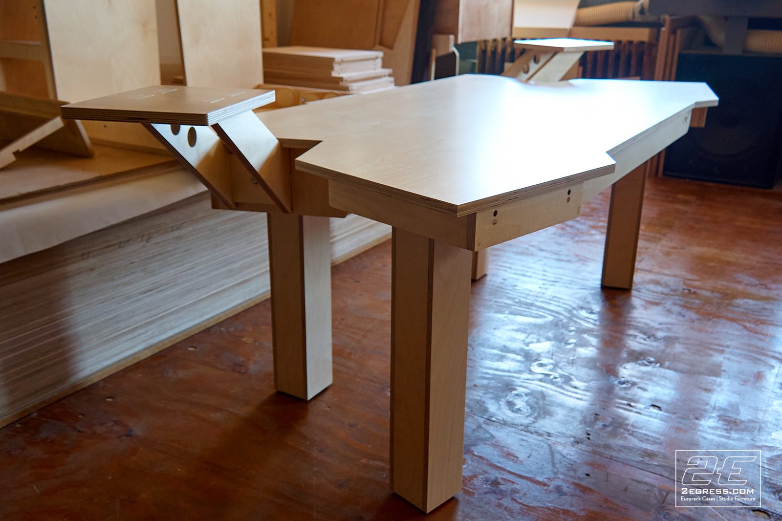 Wing Commander composer desk | side angled view of desktop and tapered legs | 2Egress