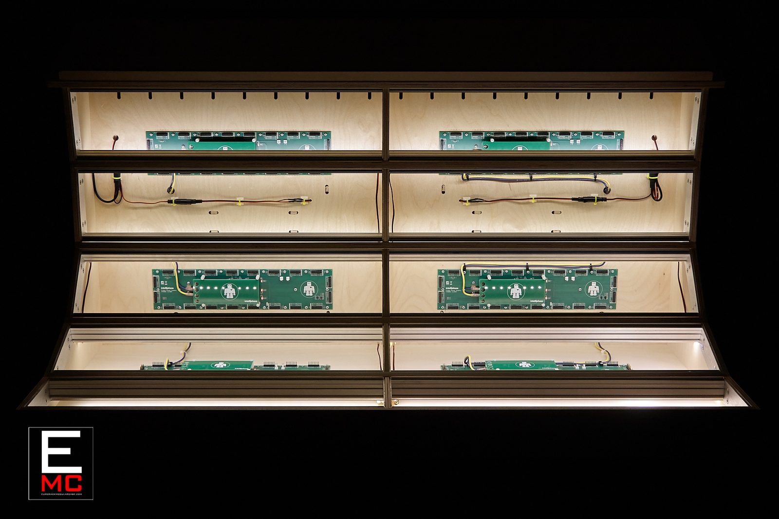 15U Constellation eurorack case | dark finish, straight-on front view, LED-lit interior with Intellijel busboards, black background studio shot | EurorackModularCase