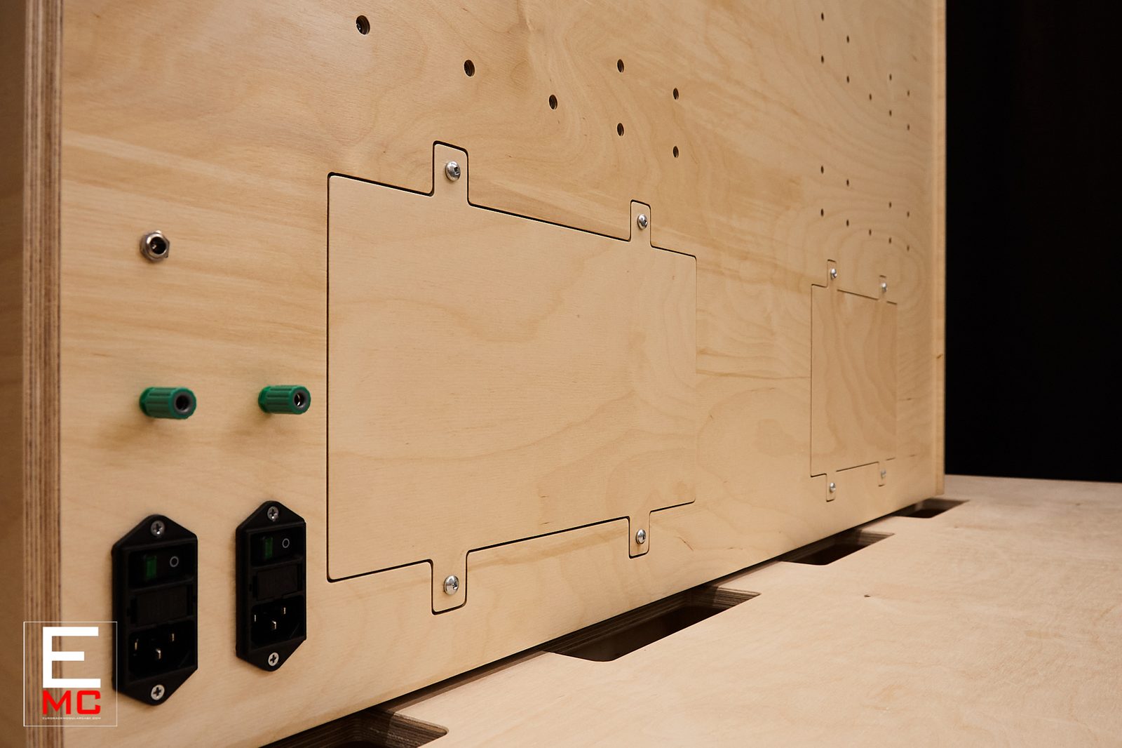 24U Barnstormer eurorack case | Front view under warm white LED lighting, populated with Genus Modu busboards | EurorackModularCase