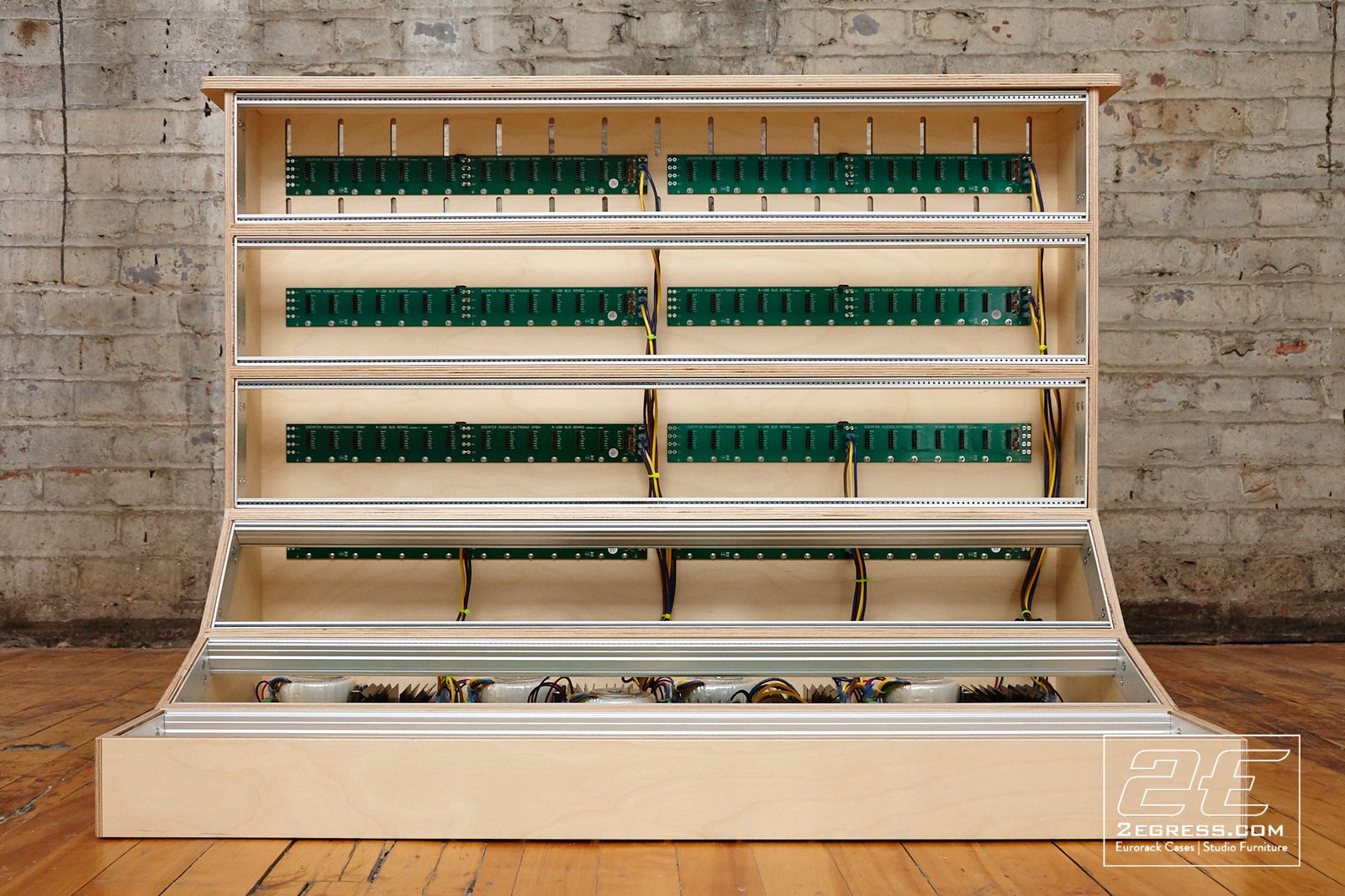 Charles Dworetz | Empty 18U eurorack case showing its internal bus boards, power wiring, and rack rails before modules were installed | Studio Egregia