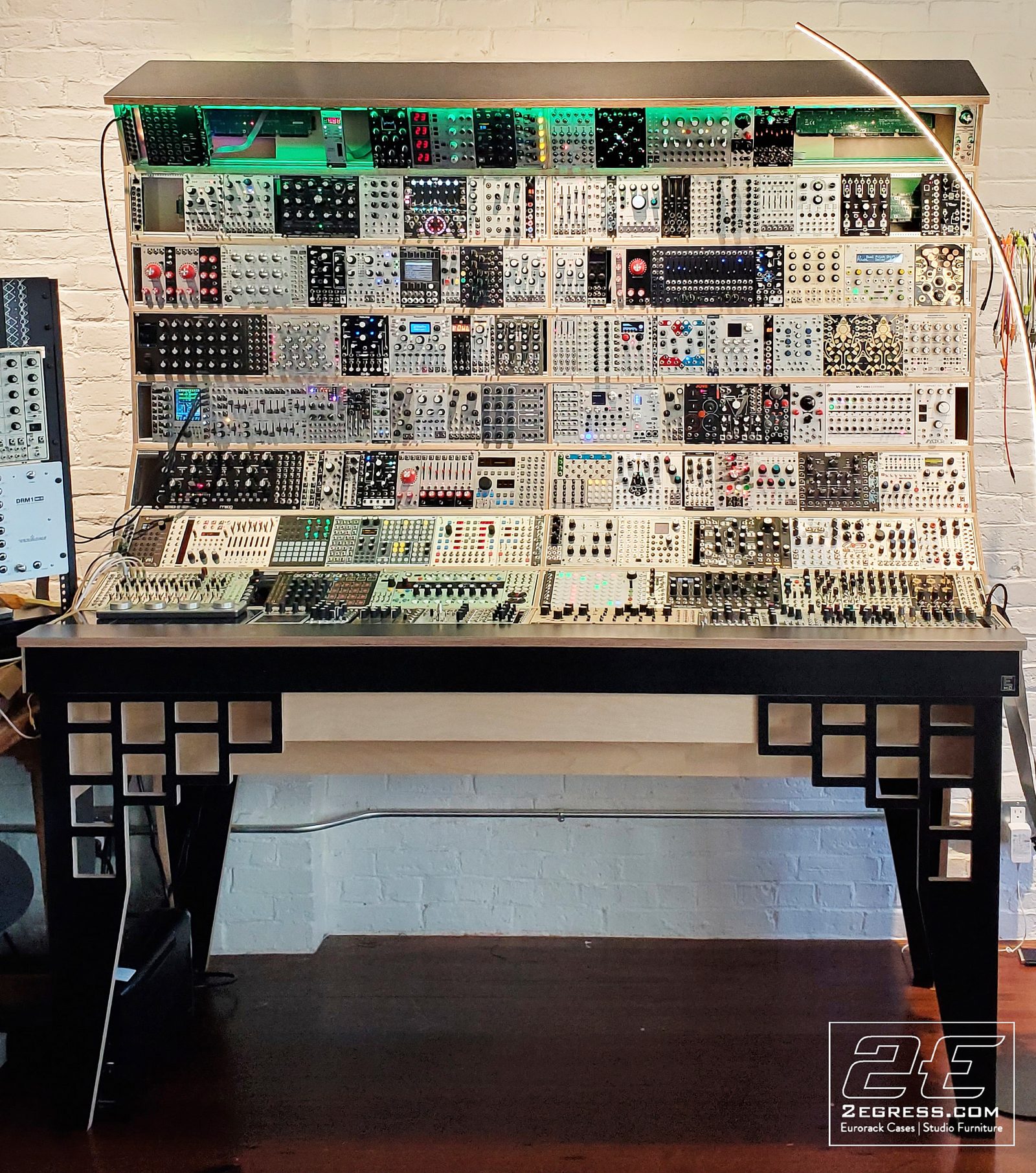 David Forman | Fully loaded 'Gunslinger' case front view in Boston studio with white brick wall | Studio Egregia