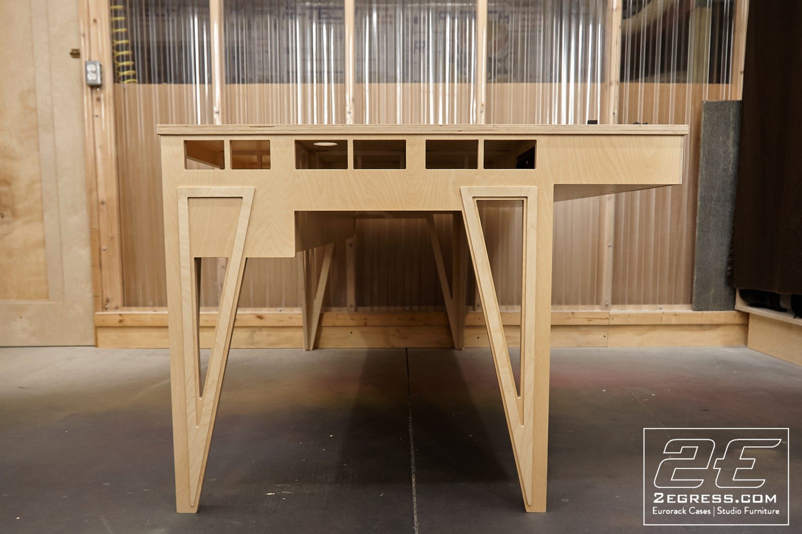 James Jacobs | Front view of the 'Zeus' desk's triangular hairpin-leg undercarriage | Studio Egregia