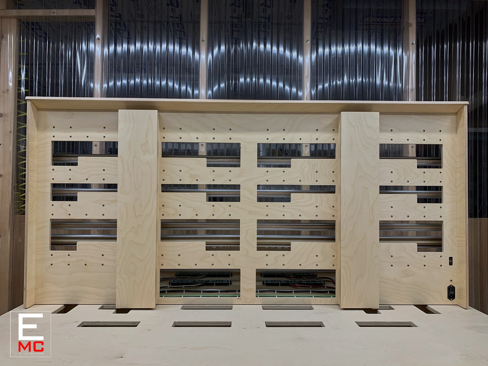 Jamie Lidell | Rear view of the unfinished 19U case standing upright, showing the back panel with power switch and bus boards visible through the rail openings | Studio Egregia