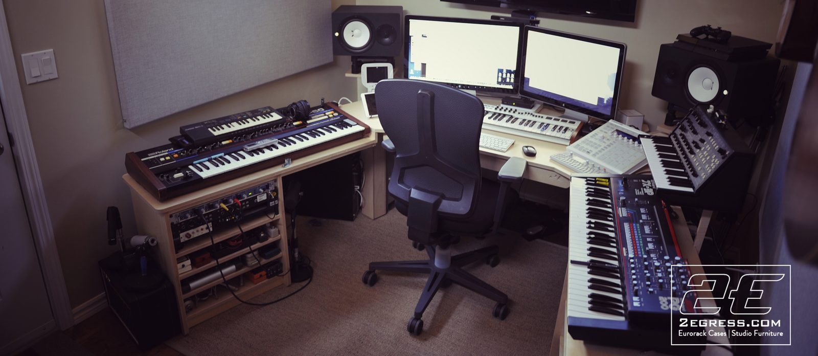 Jim Guthrie | Wide angle of the Wing Commander desk setup with keyboards and rack gear on both wings | Studio Egregia