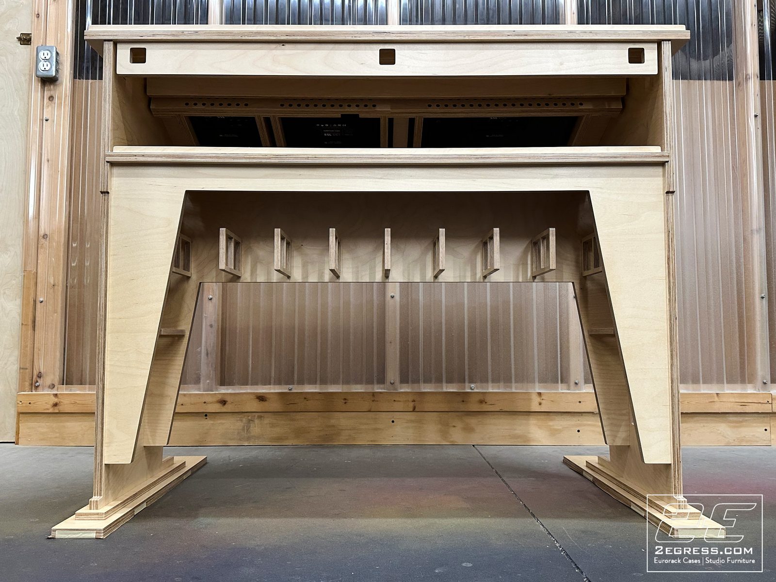 Jon Rhoten | Rear view of the Europa desk's understructure showing internal cubbies, dividers, and a translucent back panel | Studio Egregia
