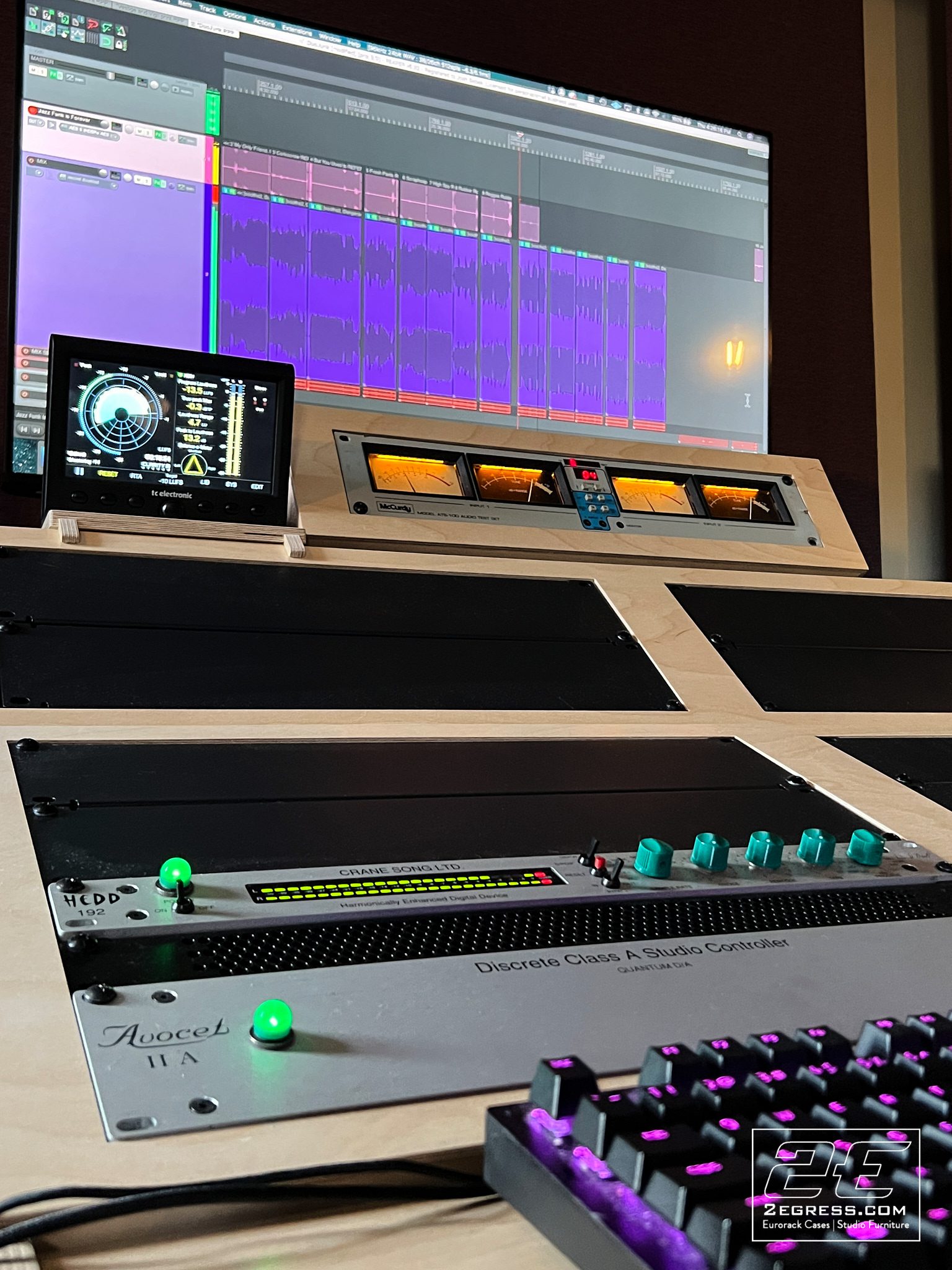 Josh Sebek | Detail of rack gear on the finished Lotus desk, including a Crane Song Avocet II A and backlit keyboard | Studio Egregia