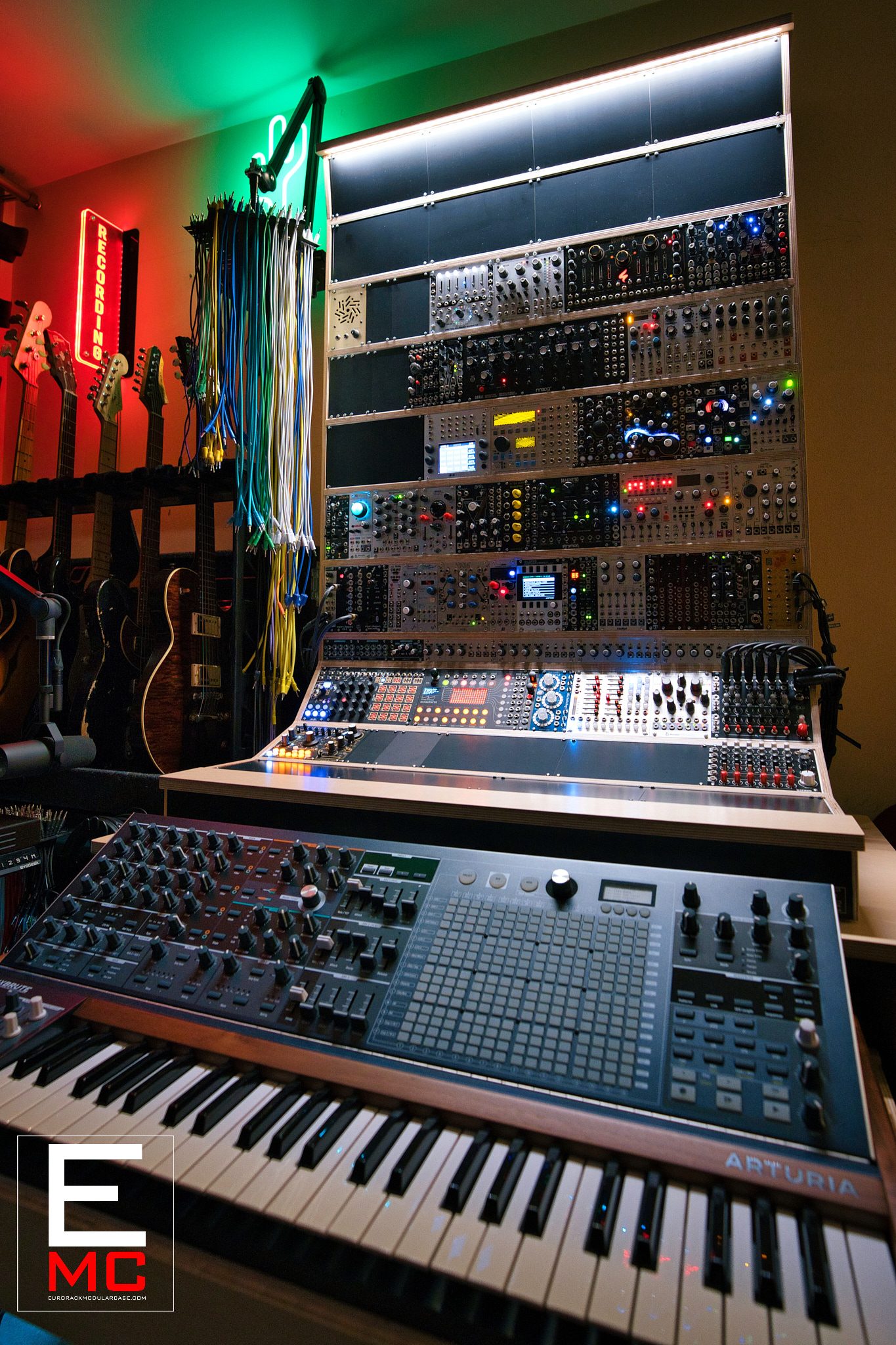 Nate Lueck | Studio view with the Arturia MatrixBrute keyboard prominent below the eurorack wall | Studio Egregia