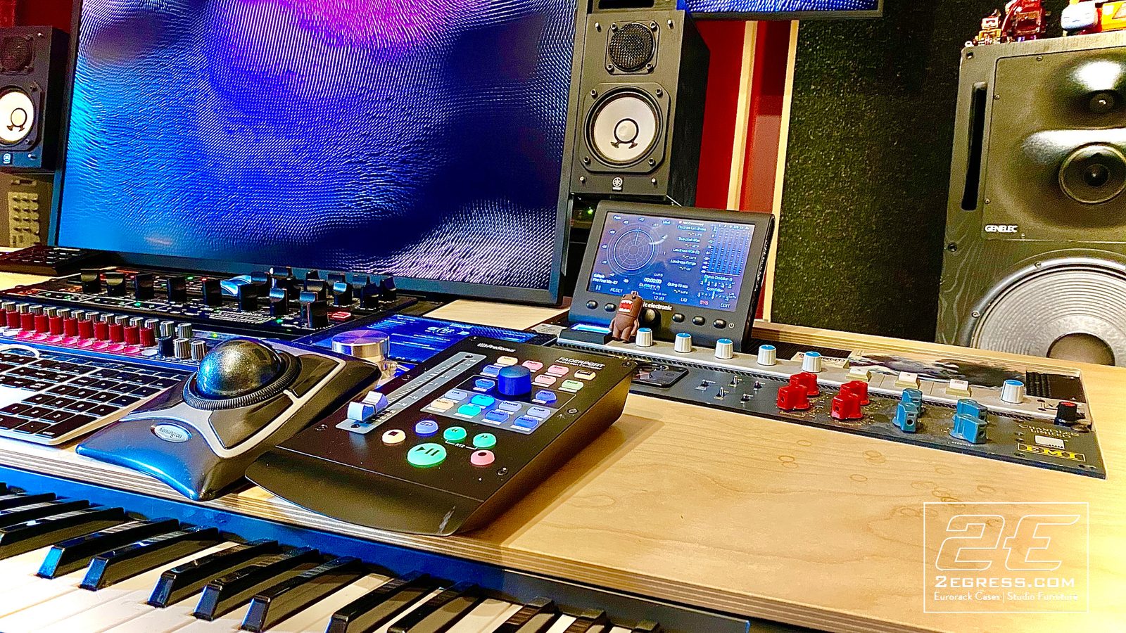 Neil Parfitt | Close-up of the VTOL desk surface showing a trackball, PreSonus FaderPort, and outboard gear | Studio Egregia