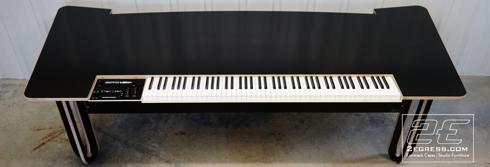Rich Walters | Front view of the finished Luna desk with its built-in weighted keyboard | Studio Egregia