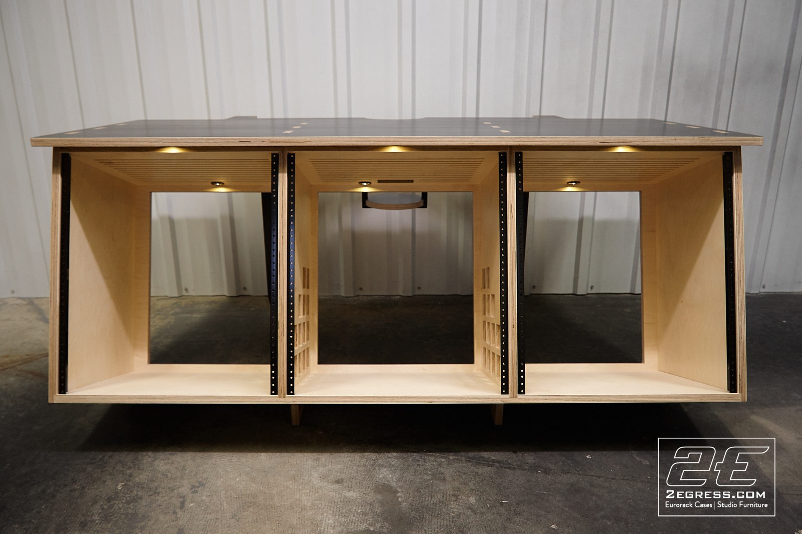 Rich Walters | Front view of the three-bay SPUTNIK equipment rack with integrated LED downlights | Studio Egregia