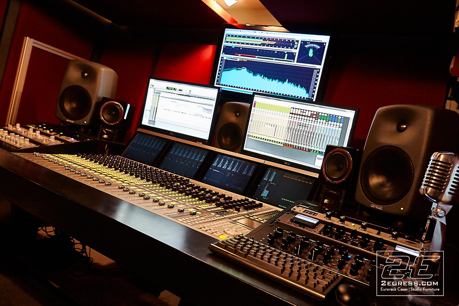 Ron Skinner | Angled view of the console and monitors with a vintage-style microphone beside the desk | Studio Egregia