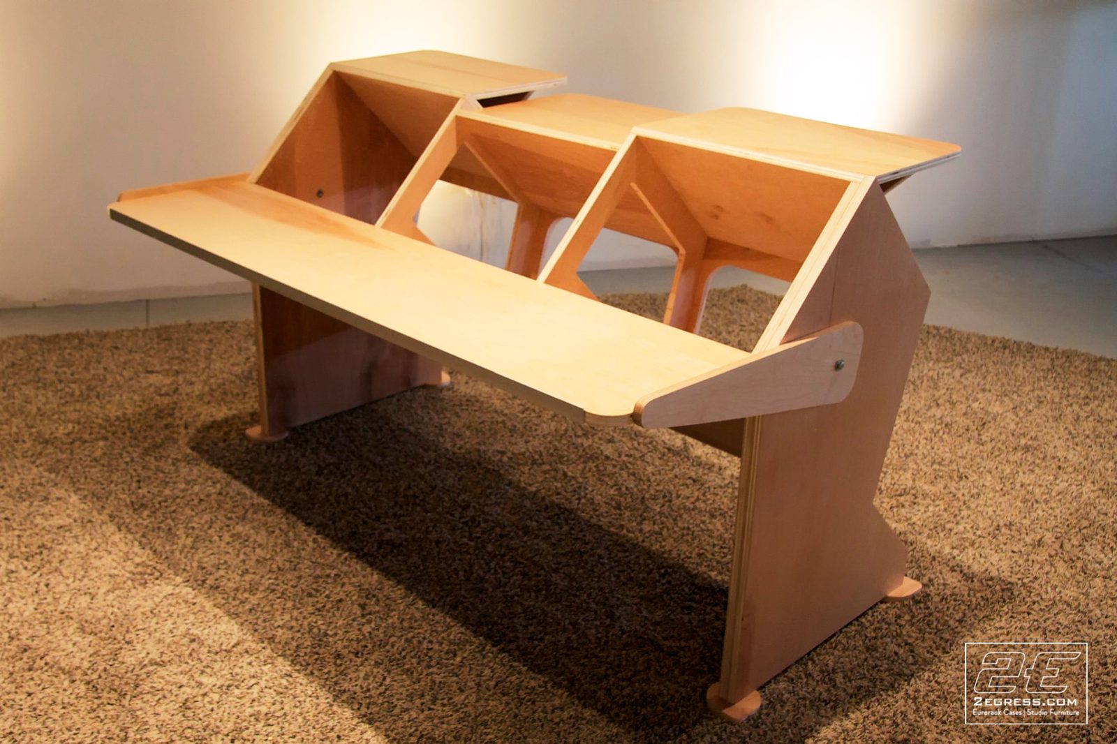 Steven Mek | Unfinished 'Low Rida' desk with tiered peaked risers, three-quarter view | Studio Egregia