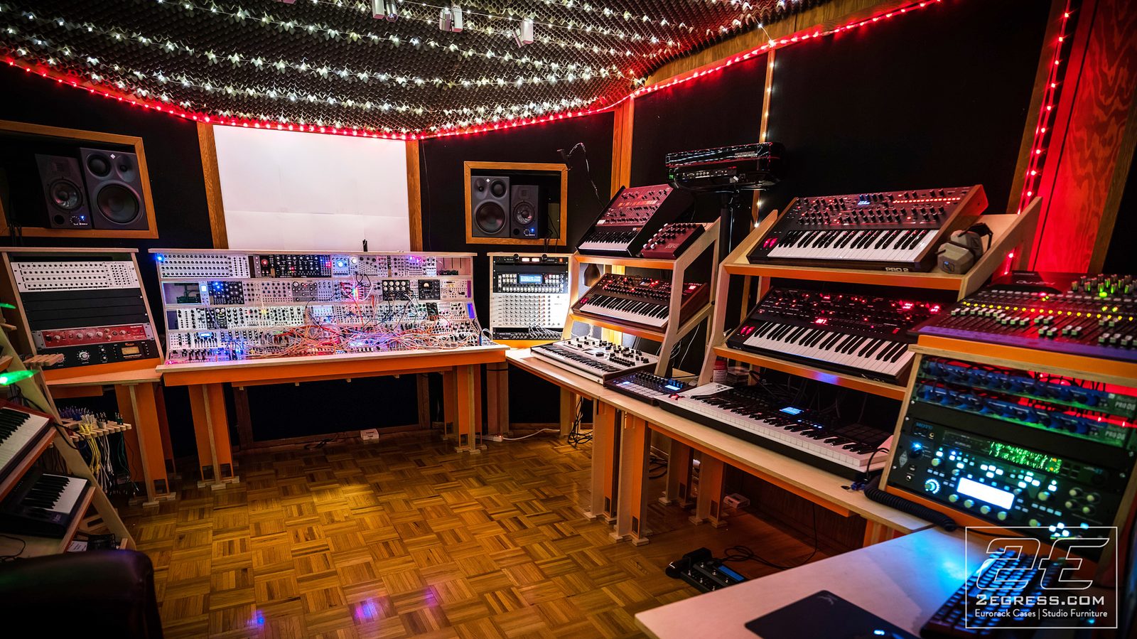 Tyler Doty | Studio corner showing the eurorack case alongside a wall of analog synths and a mixing rack | Studio Egregia